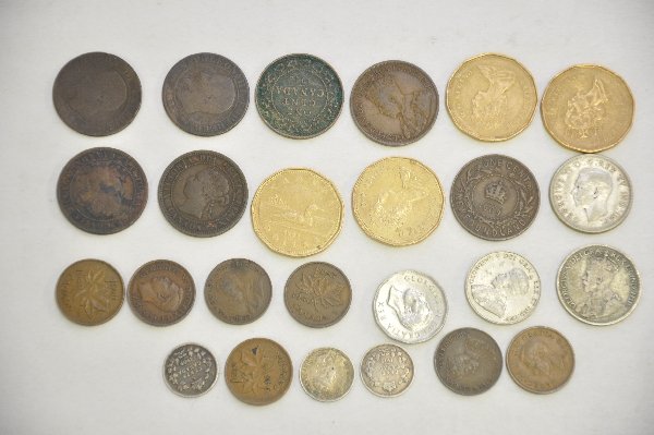 25 Canadian Coins, Some Silver: 1918 25 Cent, VF; 1922 5 Cent, EF; (5) 1940 to 1951 1 Cent; 1912 1 Cent, VF; 1917 1 Cent, VF; 1945 25 Cent, EF; 1909 5 Cent, VF; (2) 1919 5 Cent, VF; 1876 & 1893 1 Cent, VF; Newfoundland 1909 1 Cent, 