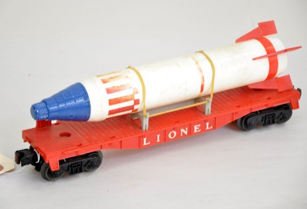 Lionel 6807 Flat with Rocket: One of the tougher space cars to find. This is an original rocket with capsule, both marked sterling. Rocket is worn & dirty on a nice flat, C6-