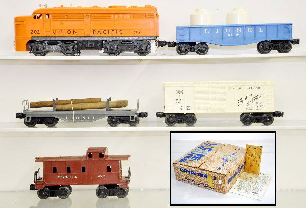 Boxed Lionel Set 1569: Circa 1958; 202 UP Alco A diesel, painted on blue mold; 6111 flat with logs; 6112 gondola with canisters; 6014 boxcar; 6017 caboose, track & transformer with peripherals, set box, trains show light pl
