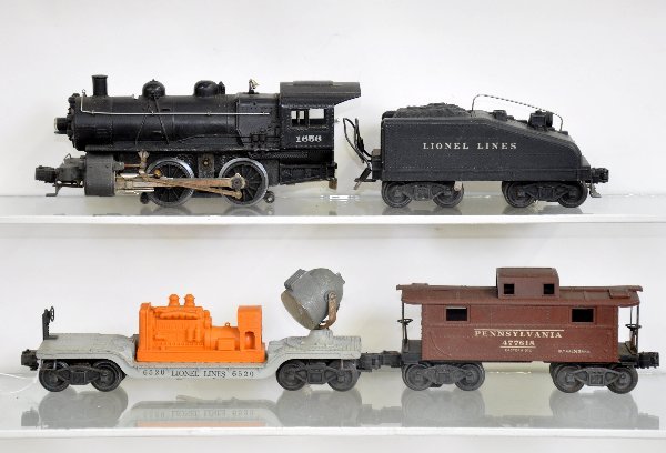 5 Pc. Lionel Steam Freight Set: 1656 Steam switcher; 6403B tender with bell & light; 6520 searchlight, bracket rusty, ob with instructions; 2672 caboose, all show light to moderate playwear, C7-, plus a 6257 caboose, cracked corner,