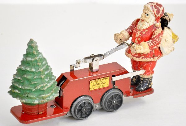 Lionel 1105 Santa Handcar: Clean with shiny base. Figures show some flaking, but mechanism functions with an incorrect key. Shows moderate to heavy playwear, C5-6