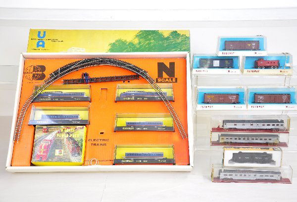 Boxed N Gauge Train Lot: Includes Bachmann Turbo-Train Streamliner set with track, set box & insert; 5 Parkway freight cars; Rapido Penn Central Cast Alco diesel, ob; 3 MRC Santa Fe Passenger cars in boxes, all show light pla