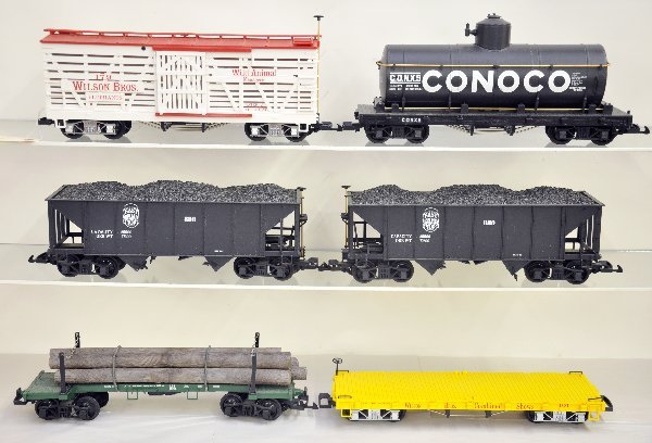 6 LGB Freight Cars: G Gauge. Wilson's circus flat & stock car; 2 East Broad Top hoppers; Conoco tank car & Log car, all dusty, but show light playwear, C8