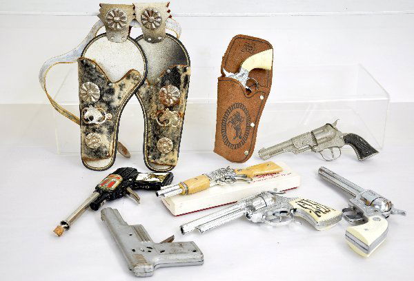 9 Pc Cap Gun & Holster Group: Boxed Nichols Spitfire Hip Gun; Tin Japanese Colt Pop Gun; Fancy Holster set; Nichols Stallion 38, needs spring; unmarked cast gun; Nice Coyote (possibly Leslie-Henry); All Metal Bell pistol; Young Bu
