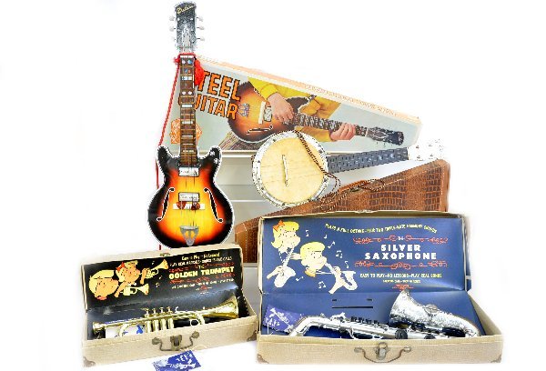 4 Boxed Toy Musical Instruments: Emonee Saxophone, Golden Banjo & Golden Trumpet; TN Japan, 28" litho tin Steel Guitar, all have original boxes and show light to moderate playwear. Examine photos or call for more information at 203 7