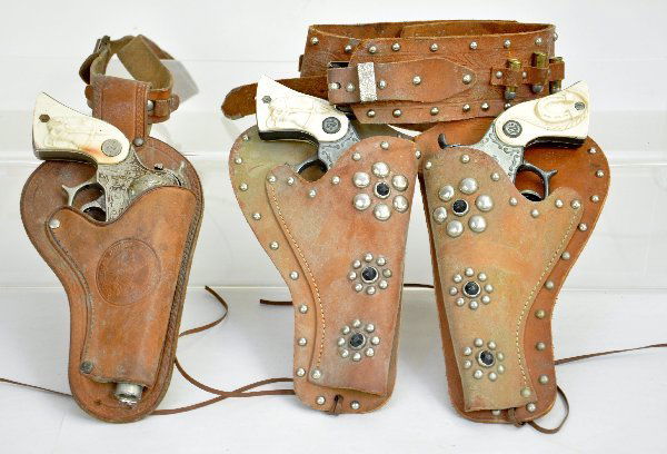 Wyandotte Cap Gun & Holster Lot: Includes a Red Ranger with matching single holster; Plus a matched pair of guns and double holster set. All function and show moderate playwear. Examine photos or call for more information at 203 730-