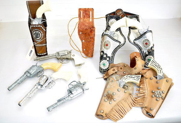 Pony Boy Cap guns & Holsters: Includes 2 matched double gun & holster sets, plus 5 additional guns and 2 single holsters. Most are functional and all show moderate playwear. Examine photos or call for more information at 203 730-1