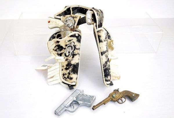 Vintage Cap Gun & Holster Lot: Lesley-Henry Texas revolver & Detective automatic; Cast iron Cowboy King Pistol, some surface rust with a very ornate holster set. Examine photos or call for more information at 203 730-1404.
