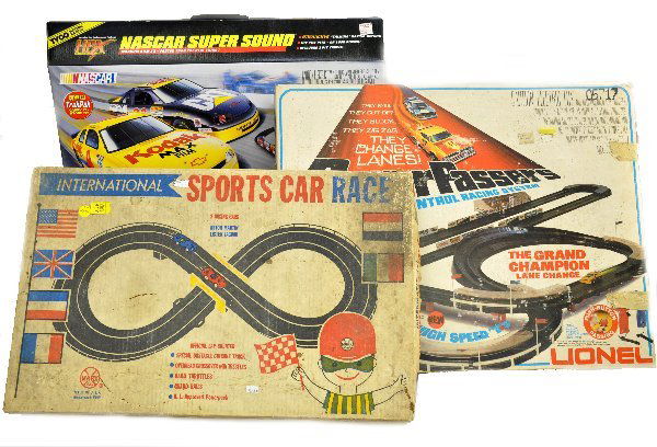 3 Boxed Slot Car Sets: Lionel 3725 Power Passers Grand Champion set (HO red Corvette & blue Charger); Tyco 37574 HO NASCAR super sound, sealed in box & a Marx 1/35 International Sport Car Race. All otherwise appear complete