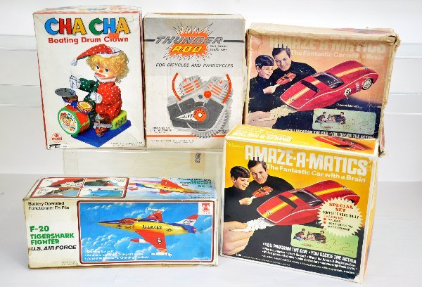 5 Boxed Battery Toys: 2 Hasbro Amazamatic Corvette Sets, 1 is like new, the other is loose in worn box; Murry Thunder Rod Bicycle Motor; Tam Toys F-20 Tiger Shark Fighter; Cha Cha Beating Drum Clown. All otherwise show lig