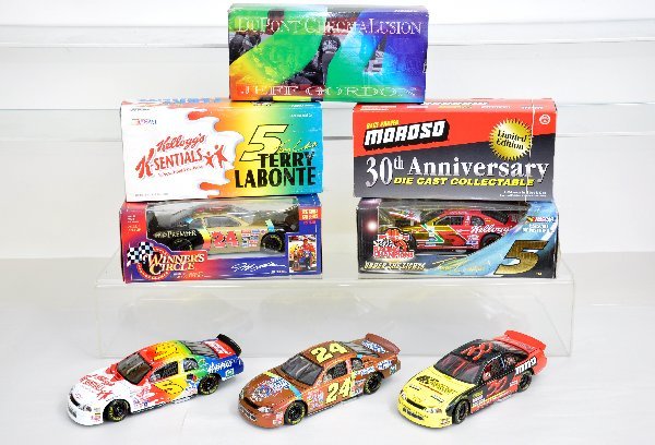 5 Boxed 1:24 NASCAR Vehicles: Action Moroso 1998 Monte Carlo; Racing Champions Terry Labonte Under The Lights #5; Action Jeff Gordon 1998 Monte Carlo; Action Terry Labonte 1999 Monte Carlo; Winners Circle Jeff Gordon 1997 Pro Stoc