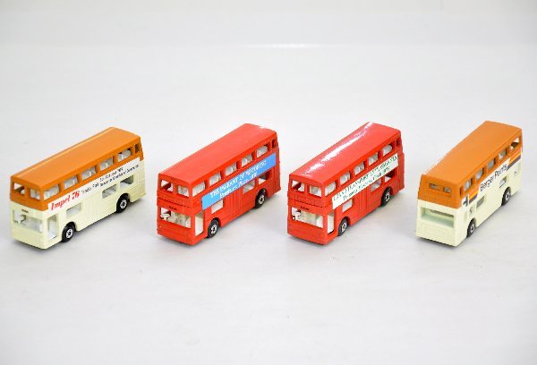 4 Scarce Matchbox 17 Busses: Includes 1976 Grand Transport Museum; Brown/cream Berger Paints; 1976 Pageant of Motoring & brown/cream Impel 76, all are like new with plastic 5-car display case. C9