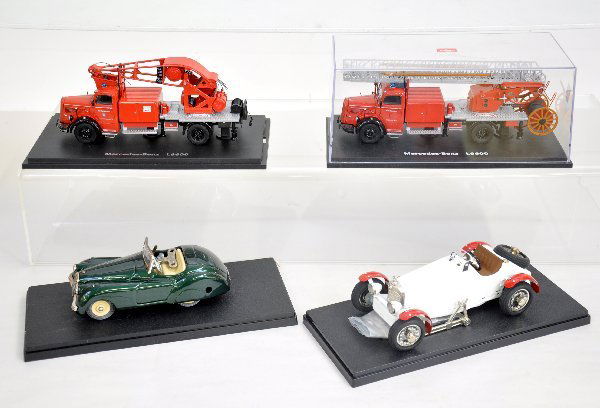 4 Schuco Vehicles: Studio V Mercedes SSK with accessories; Examinico SSK120 with key & instructions; 2 Mercedes L660 fire trucks, all are like new with plastic display cases. Examine photos or call for more information