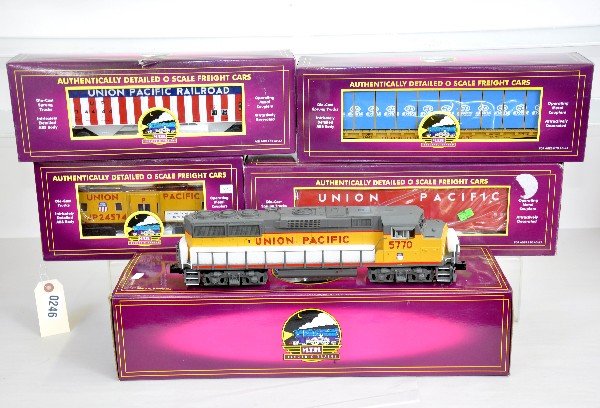 5Pc MTH UP Diesel Freight Set: 20-2403-1 GP-60M diesel with dual motors, ProtoSounds 2 with freight yard effects; 20-97142 hopper; 97515 wood chip hopper; 981333 flat with lumber; 91199 bay window caboose. All test run with origina
