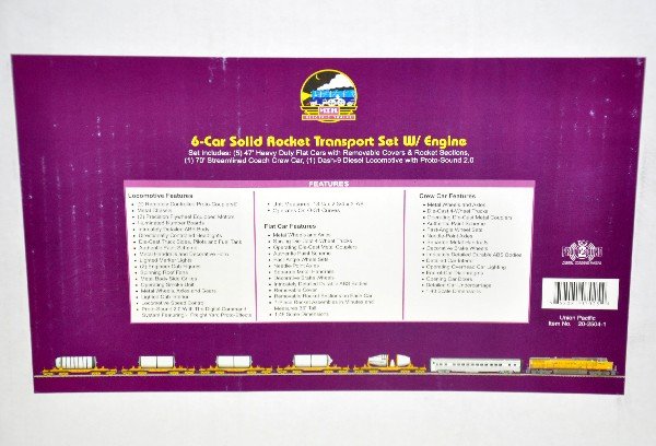 MTH 20-2504-1 Rocket Transport Train Set: Somewhat of a scarce set which includes a UP dash-9 diesel engine/ 5 47' heavy duty covered flat cars containing space rocket sections and a 70' streamlined coach crew car. This set is unrun with its 