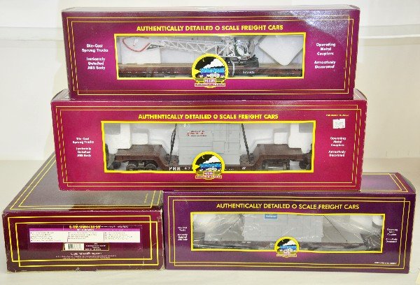 MTH Premier Freight Cars: 20-95048 CSX 2 car spline set; 98122 flat car; 98690 flat with helicopter; 98355 flat with transformer. All are like new with boxes, C9