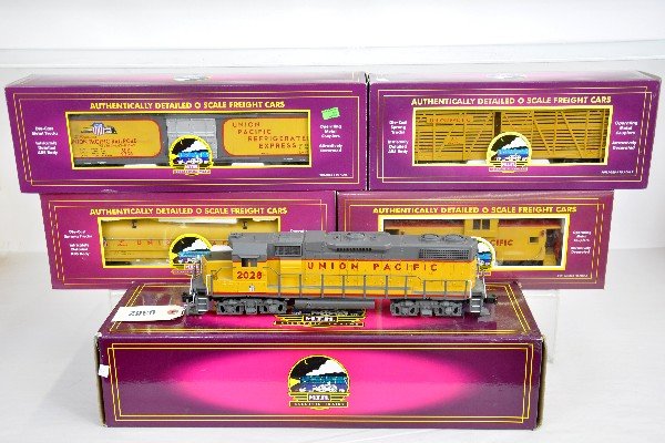 5Pc. MTH UP Diesel Freight Set: 20-2186-1 GP38-2 diesel with dual motors, ProtoSounds 1 with squeaking brakes & freight yard sounds; 20-94032 reefer; 98204 coil car; 94502 stock car; 91018 extended vision caboose. All appear like ne