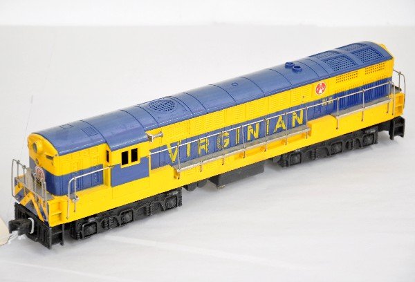 Lionel 2331 Virginian FM Diesel: Double motors with clean battery box, hairline cracks on both ends and a crack on roof near exhaust stacks. Over-all shows moderate playwear, C6-