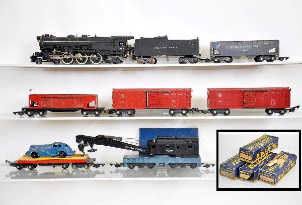 7Pc American Flyer Steam Freight Set: S Gauge. 312 PRR K-4 steam loco, missing coupler; 2 #633 boxcars, obs; 715 unloading car, Manoil roadster is C5; 716 coal dump, odd ob with bin; 644 crane, late colors; 640 hopper, ob, all show modera