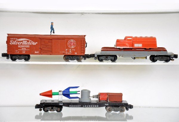 3 American Flyer Operating Cars: S Gauge. 915 Renwal unloader (C6+); 970 animated boxcar; 969 rocket launcher. All are clean & show light playwear, otherwise C7-7+