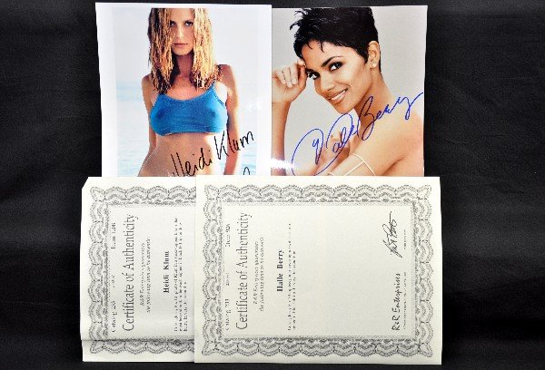 Signed Halle Barry & Heidi Klum Signed Photos: Both 8 x 10 glossy, both signed in marker. Halle Berry's photo is a demure topless pose. Both include certificates of authenticity (not from NETTE)