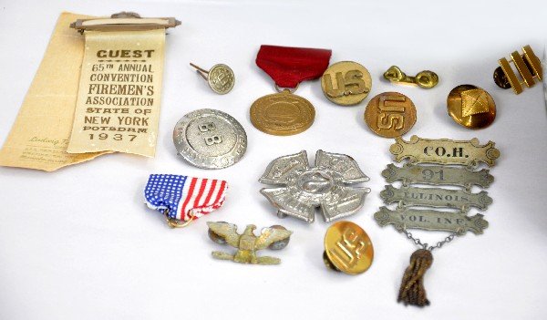 Army & Fire Fighter Insignias & Badge: Nice group of older fire fighter pieces. Includes Greenwich (CT) #2 badge; 1937 Fireman's convention pin; USS Constitution medal; CO. H. 91 Illinois Volunteer Fire Company medal set & others; Early mi