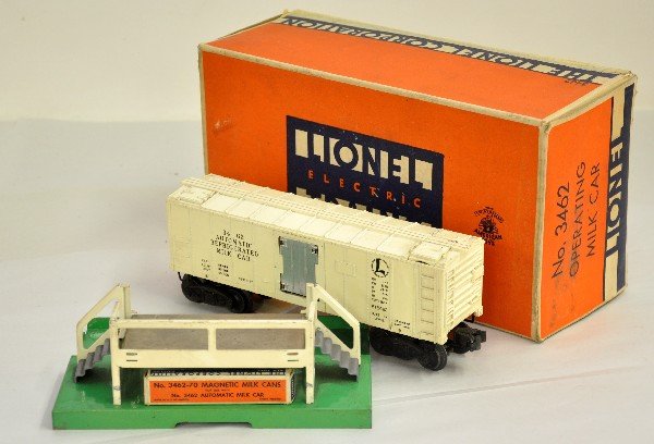 Rare Boxed Lionel 3462 Gloss Milk Car: This is the very first production with cream colored gloss finish & brass mechanism. It has its -70 cans box & nice platform with the scarce large ob with insert, has taped seam. It shows light playwe