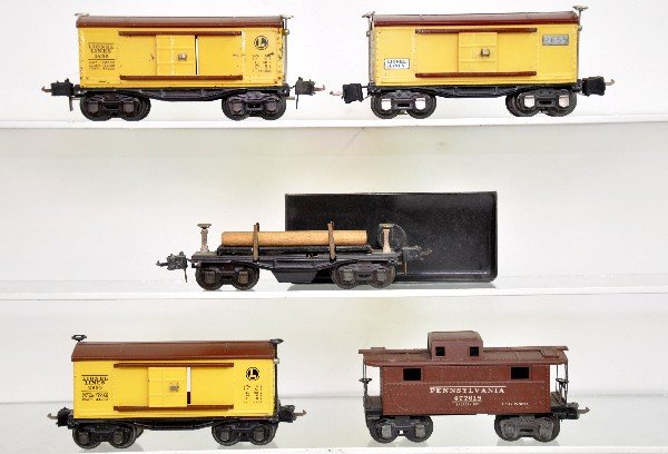 5 Lionel Freight Cars: 2672 PRR Caboose; 3 different 2655 boxcars, 1 rough ob; 3651 lumber car with logs & bin. All show light to moderate playwear, C7-8