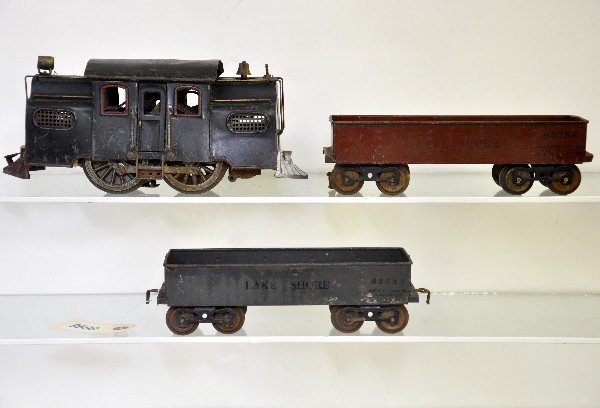 3 Pc Lionel MFG 38 Train Set: Std. Gauge. 38 St. Paul style electric with MFG plates. It is missing some trim, but lettering is readable both sides; 2 #112 Lake Shore gondolas, 1 is embossed Lionel MFG. All show moderate to heavy 