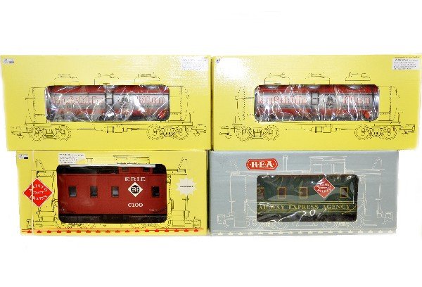 4 Aristo Craft Freight Cars: G Gauge. 42137 Erie Caboose; 42105 REA caboose; 2-41697 LSOL 3-dome tank cars. All are like new in boxes, C9