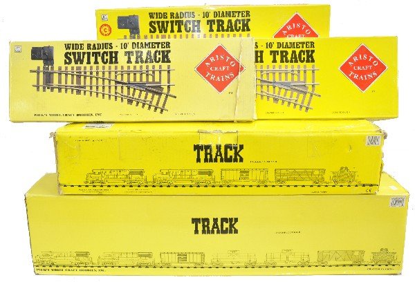 Boxed Aristo Craft Track: G Gauge. 11803 18-X-wide curves; 30060 12 2'-straight track; wide radius manual switches- 1-20370 RH; 2-20380 LH. All clean & boxed.