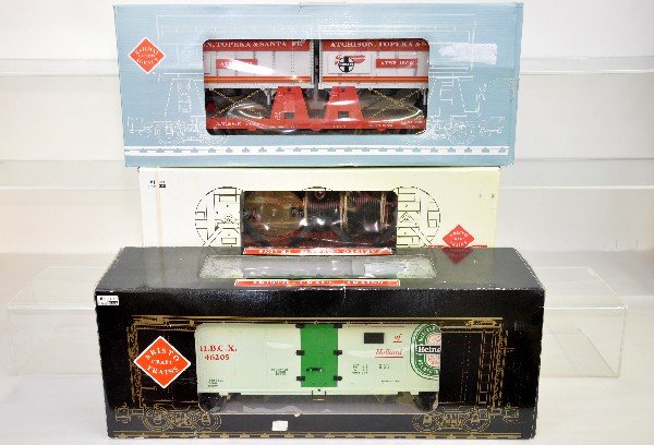 3 Boxed Arsito Craft Freight Cars: G Gauge. ART-86432 Napanapa cable reel car; 46205 Heineken Beer reefer; 46502 SFE piggyback flat. All are like new in boxes, C9-10