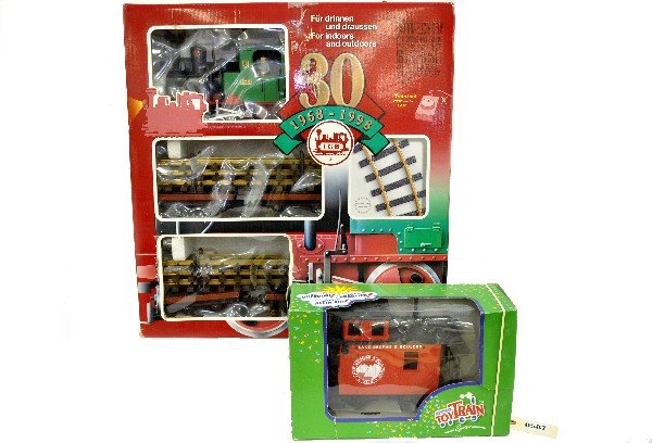 LGB 73968 Lumber Set, Plus: G Gauge. Includes an 0-4-0 loco with two dual truck lumber cars, track & transformer; Plus 94065 LG&B bobber caboose. All lightly run with boxes, C8+