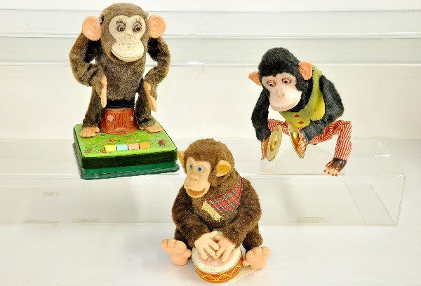 3 Battery-Op Monkey Toys: Drummer wasn't working at time of test and has a cracked battery box cover; Cymbal playing Chimp showed signs of life at time of test, but was inconsistent and has some battery damage and staining to