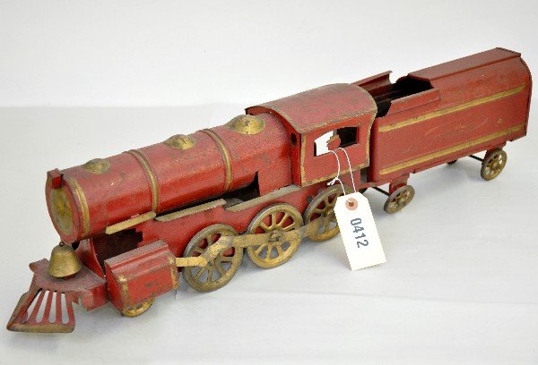 Schieble Hillclimber Steam Loco: Circa 1900, painted pressed steel, 27" long with friction stone wheel motion. Fantastic paint for 100+ years old. Should clean to C6-7