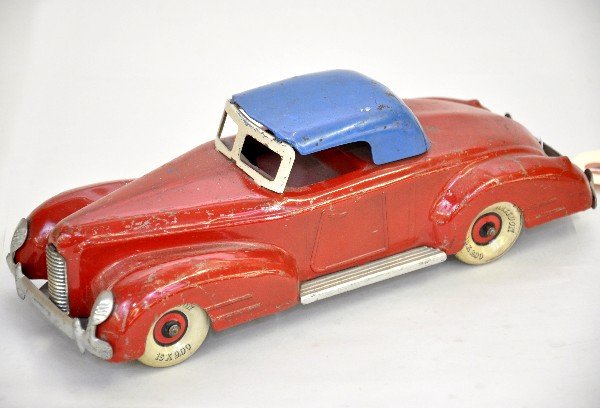1930s Marx La Salle Coupe: Pressed steel, 11" long with tin balloon tires. Nice appointments with rocker boards and separate grill and chassis mounted bumpers. It is clean & shiny with removable top, but shows moderate playwear
