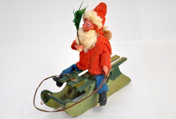 Early German Composition Santa Claus: Sleigh measures 6 1/2" long, figure has his original feather tree and is in great shape, C8