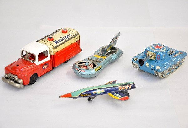 4 Pc Tin Toy Lot: 8" friction Mobilgas truck; X7 Space Tank; Navy Space ship, missing figures; Navy missile, missing 1 fin, all are clean & shiny & otherwise show light playwear, C7+