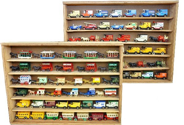 77 Lledo Days Gone Vehicles In Cases: Assorted old time vehicles in two crude plywood cases with plexiglass windows. Vehicles appear like new