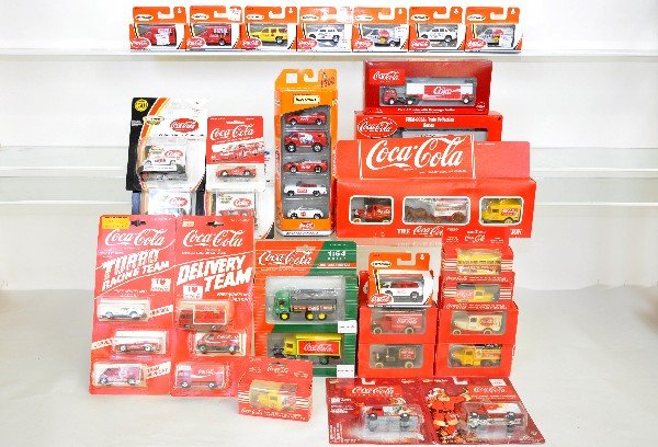 29 Hartoy & Matchbox Coca-Cola Vehicles: Nice assortment with some gift sets. All are new in dusty packaging, C10