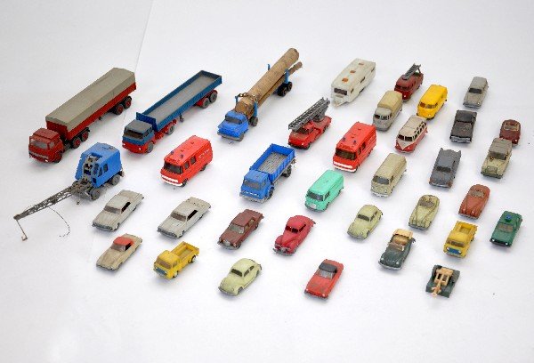 35 Wiking HO Scale Vehicles: Nicely detailed German made plastic vehicles. All appear like new, but are dirty from display. Includes an unusual mobile crane & house trailer