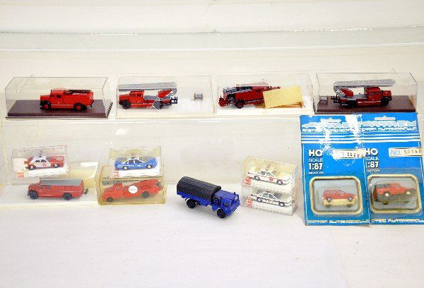 13 Boxed German HO Vehicles: 6 Berkina in plastic boxes, 4 Bush, 1 ROCO & 2 Reitze sealed on cards. Packaging is dusty, but vehicles are C10