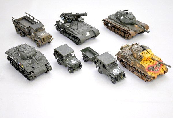 7 Corgi & Solido Military Vehicles: Corgi 1:43 factory hand decorated Sherman Tank & 2 Ton Truck; 3 Solido Tanks & two Jeeps, one with trailer. All appear like new, but dusty from display, C8+