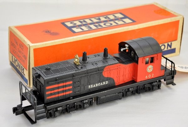Nice Boxed Lionel 602 Seaboard Diesel: Second version of the late Seaboard with horn & non-operating couplers. It is clean with bright graphics. Hairline screw crack. Shows light playwear with square on showing some tape residue, C7+-8