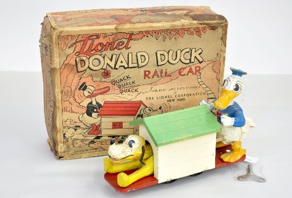 Boxed Lionel 1107 Donald & Pluto Handcar: Clean & original, but mechanism isn't functional with key. Figures show moderate playwear & flaking, worn set box with display insert & track, C6-