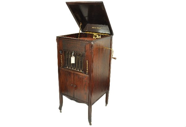 Aeolin-Vocalion Cabinet Graduola: Circa 1930's - 20 x 21 x 47 console Victrola with internal speaker, mechanism working with brass crank, mahogany cabinet speaker chamber shows wear, great exterior with gold carved details. Original p