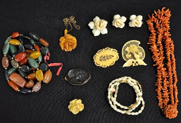 Vintage Costume Jewelry Lot: Includes a 11" coral necklace choker; 22" mother of pearl & coral necklace with gold beads; 3pc shell pin & earring set; early cameo style purple glass pin; mustard seed rose carved necklace with gold