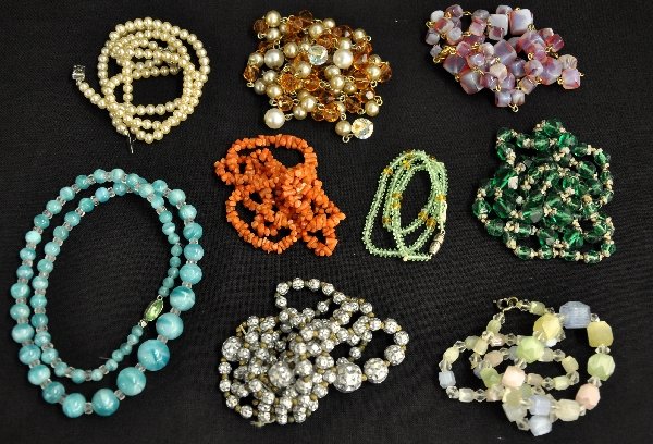 9 Vintage Costume Necklaces: Includes a 25": coral piece; 24" white & red glass square bead piece; 18" blue & clear glass piece, marked Czechoslovakia; pair of pearl colored bracelets and others. All better quality jewelry. Exami