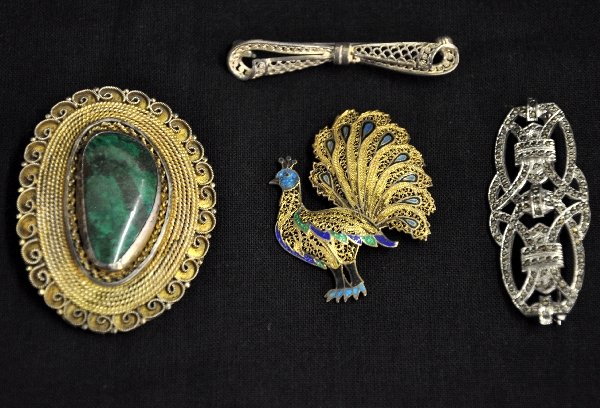 4Pc Vintage Jewelry Lot, Some Sterling: Includes 2 1/8" brass pin with malachite stone; brass & enamel pierced peacock pin; 2 1/8" sterling & marcasite pierced pin (.29oz) & 2" sterling pierced bow pin (.11oz), marked Germany. Examine photo