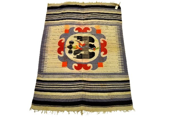 Early Figural Navajo Blanket: Circa 1920. 76 X 53". Unusual to have a non geometric design. It has wonderful natural dyes with a super bird motif with blue vignette and black & blue stripes. It shows light wear, save for a few way